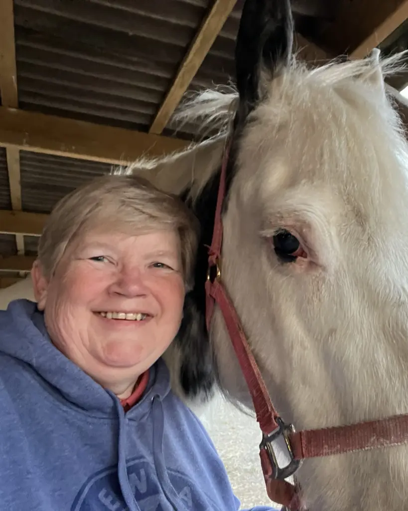 Sue smiling with a horse